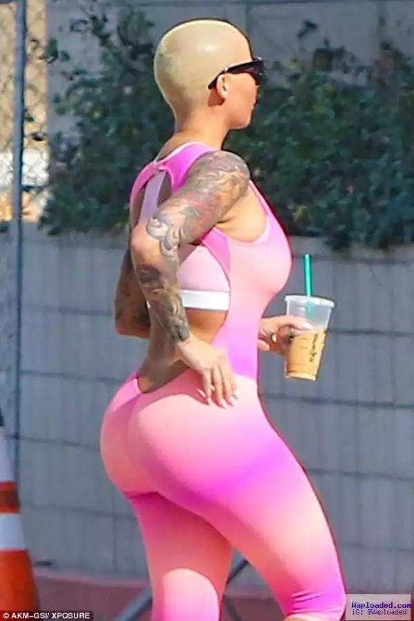 Photos: Amber Rose Looks Sexy In Pink Bodysuit